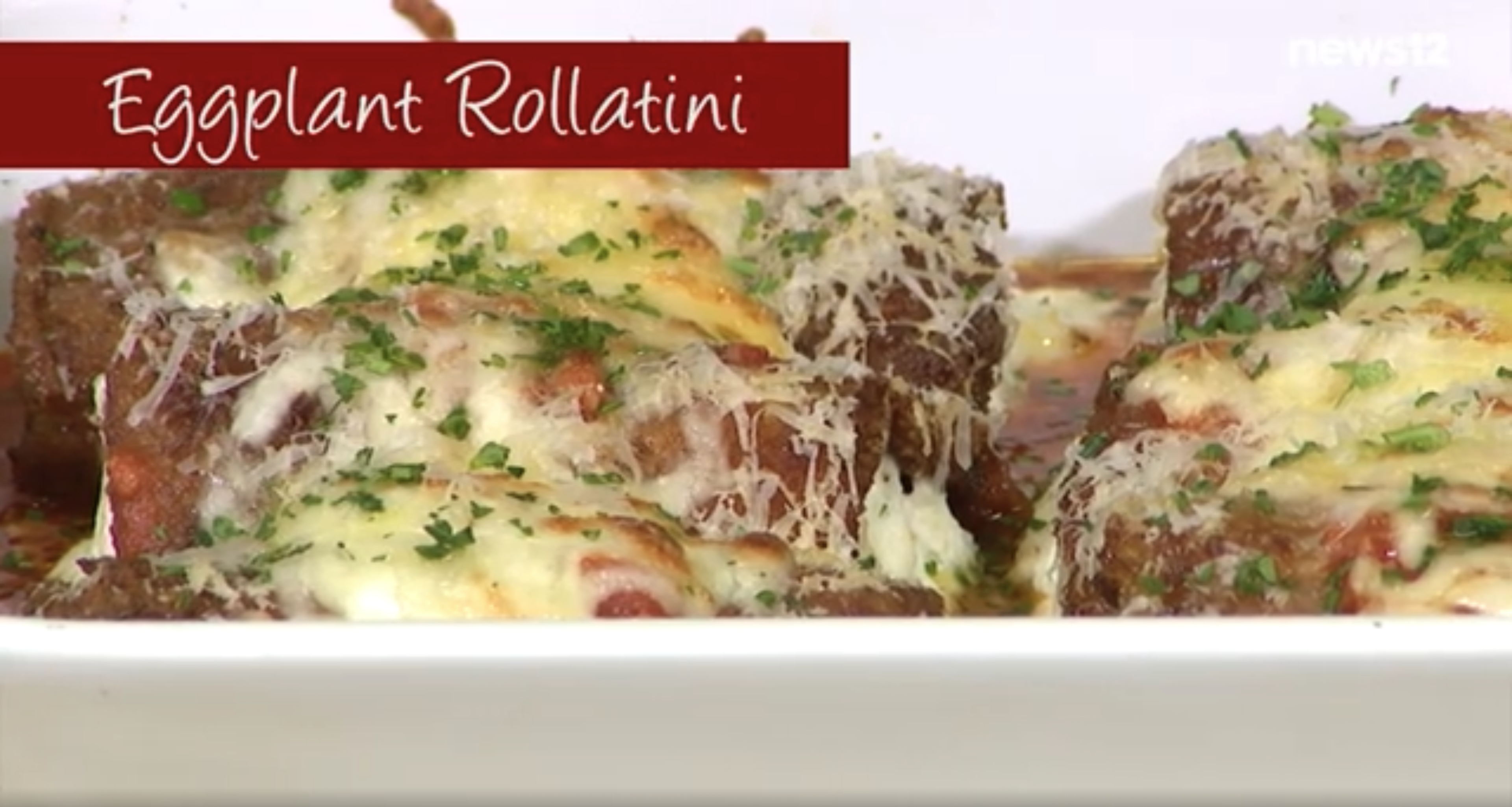 Eggplant rollatini in a white dish