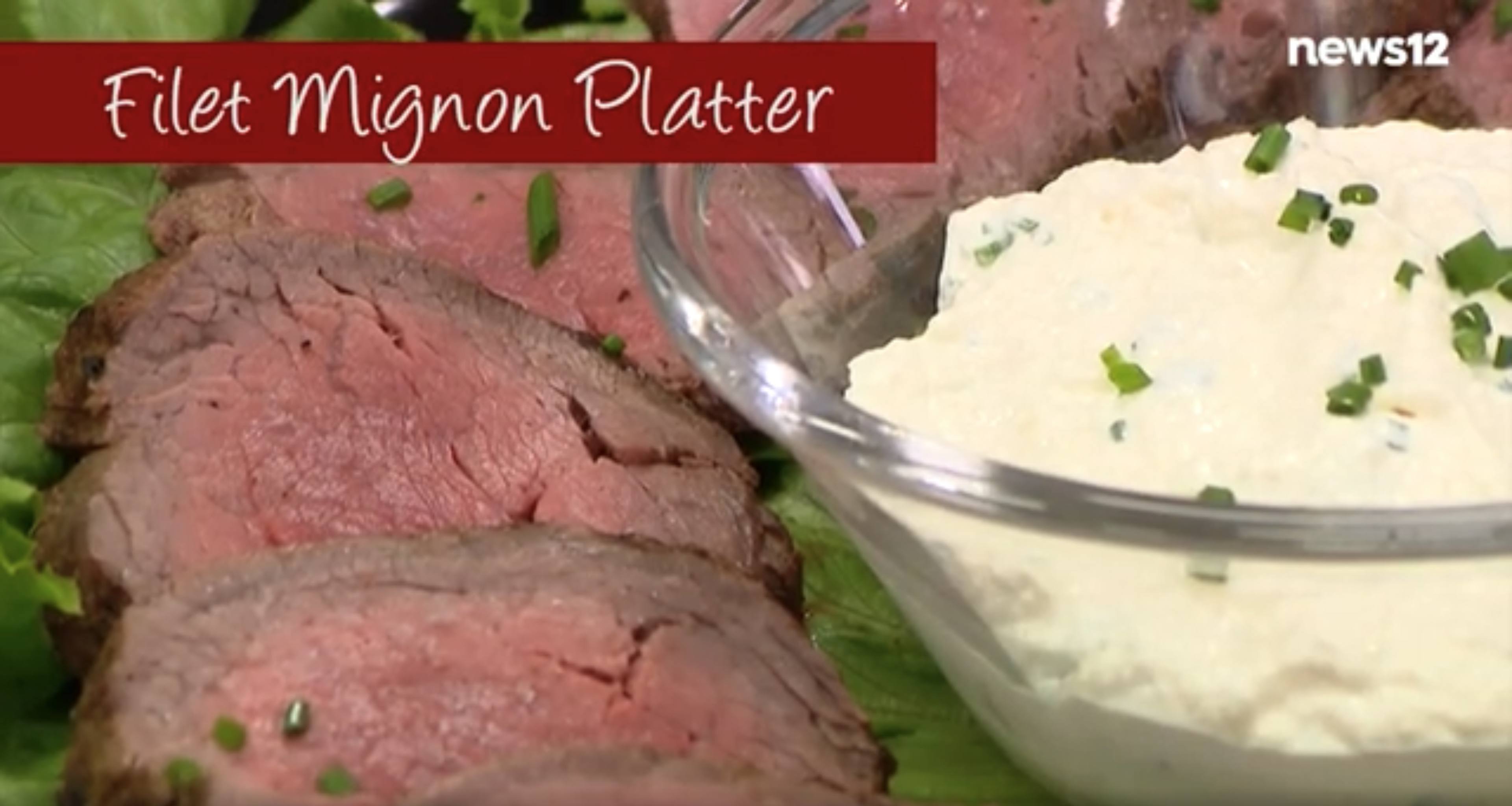 Filet mignon slices on lettuce with horseradish sauce